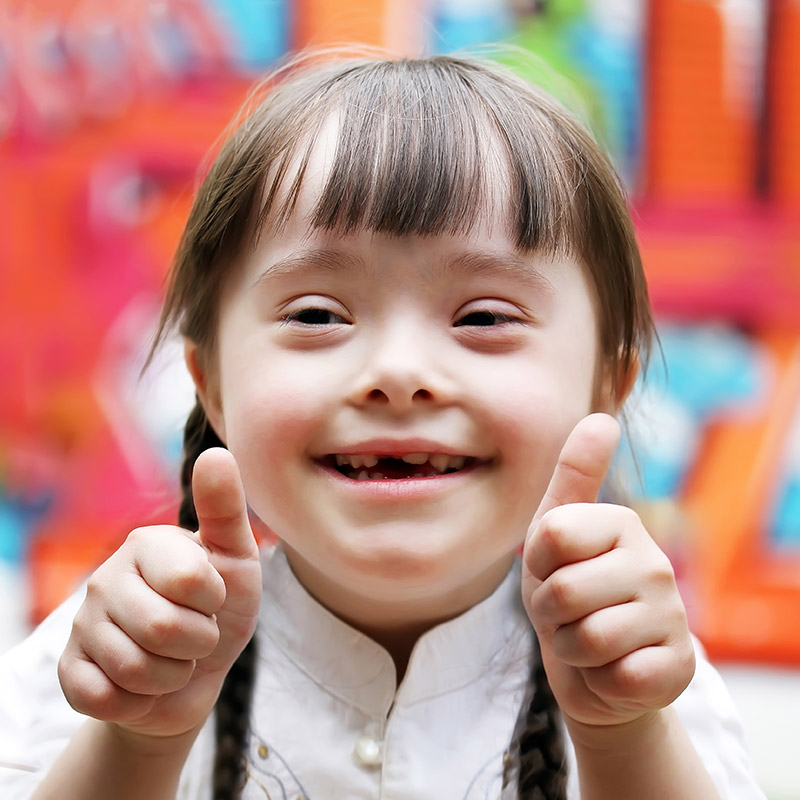 Happy Child with both thumbs up