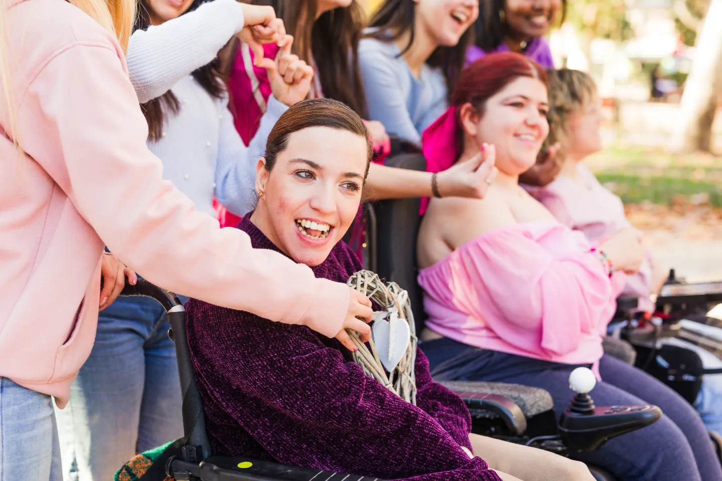 Group of women friends smiling and laughing together outside
